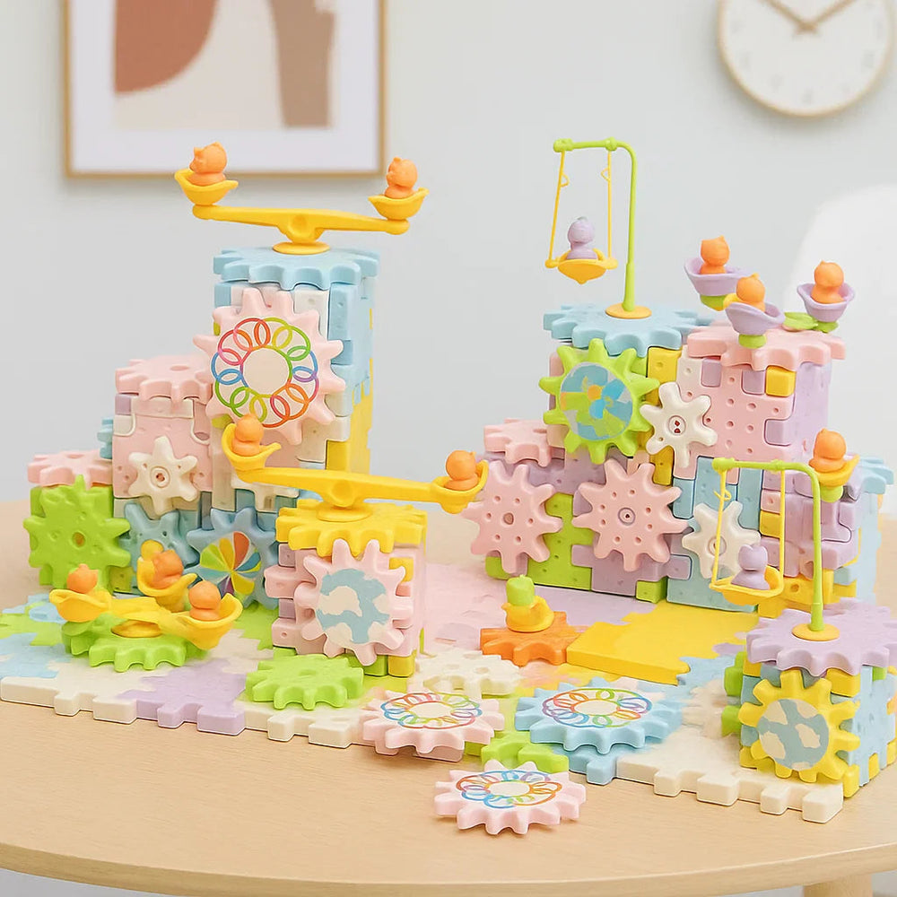 249-piece gear building set arranged as pastel towers with gears, swings, and seesaw-style rides.