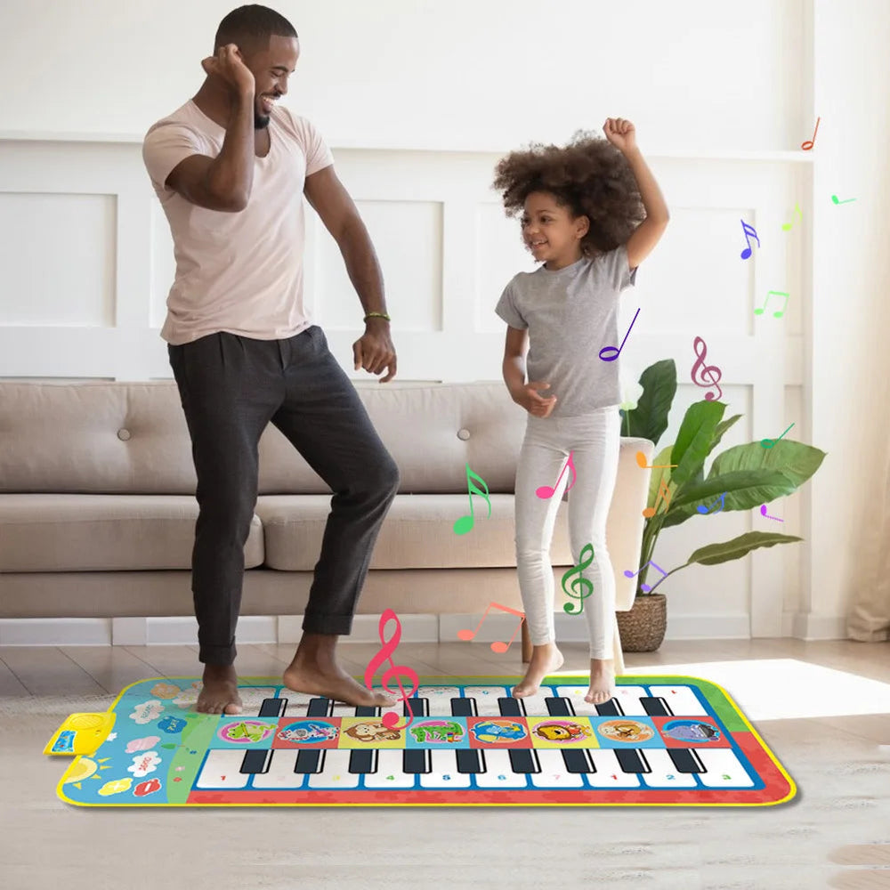 Adult and child moving together on a piano play mat in a living room