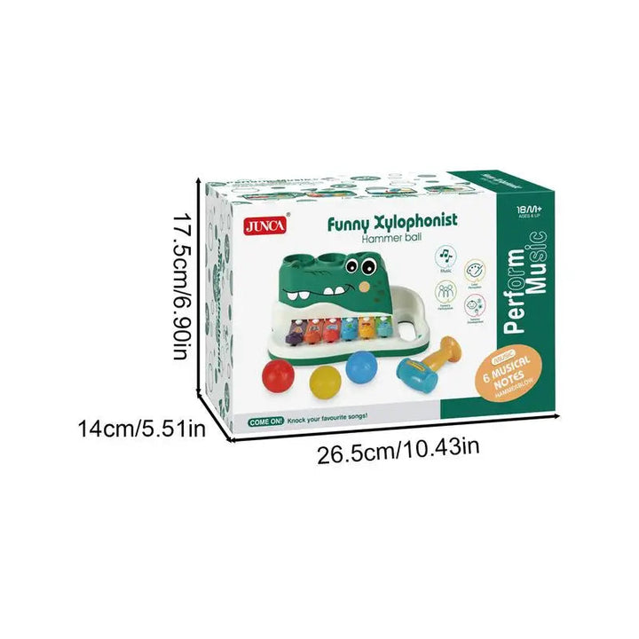 Alligator musical toy packaging with labeled box dimensions of 26.5 × 14 × 17.5 cm