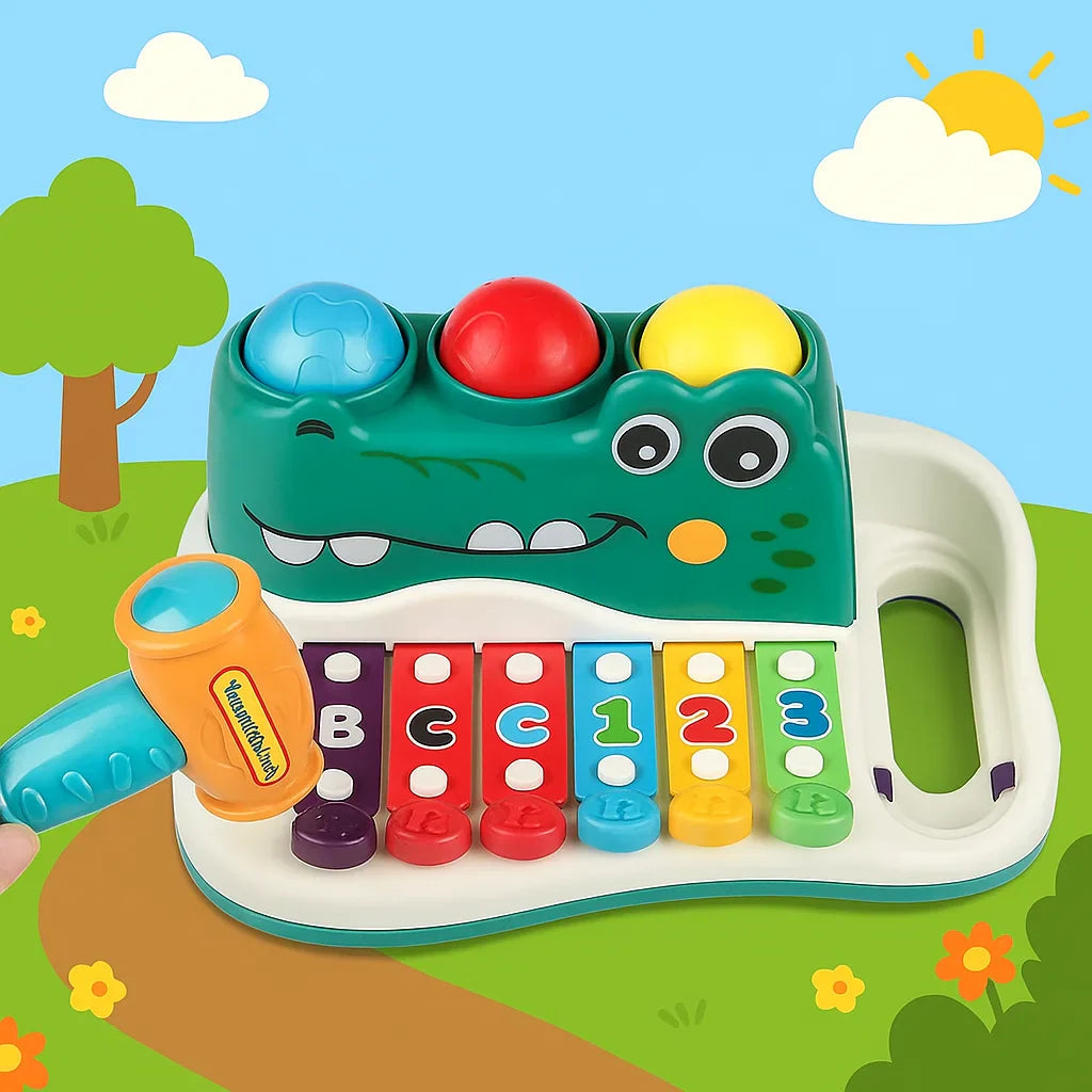 Alligator xylophone toy with six colorful keys, three balls, and a hammer on an illustrated background