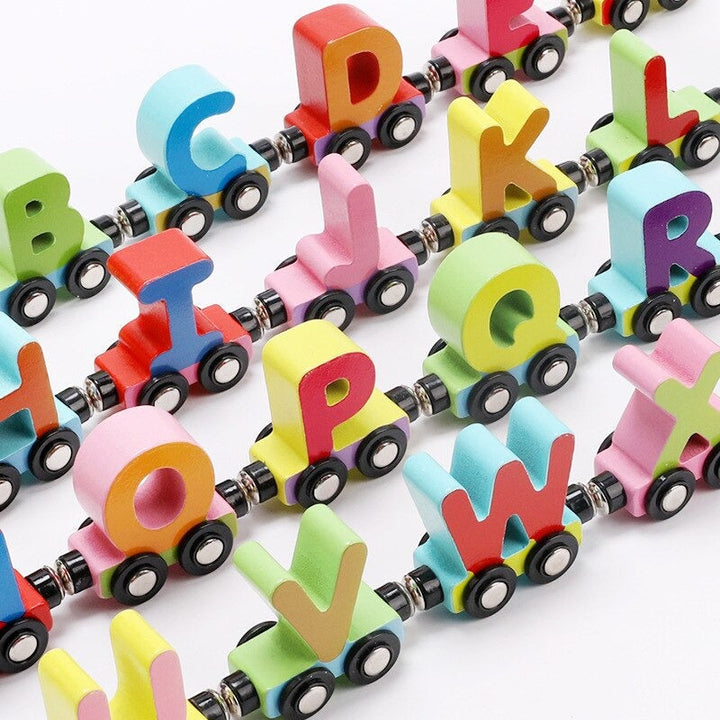 Close-up of colorful wooden alphabet train cars and their magnetic connectors.