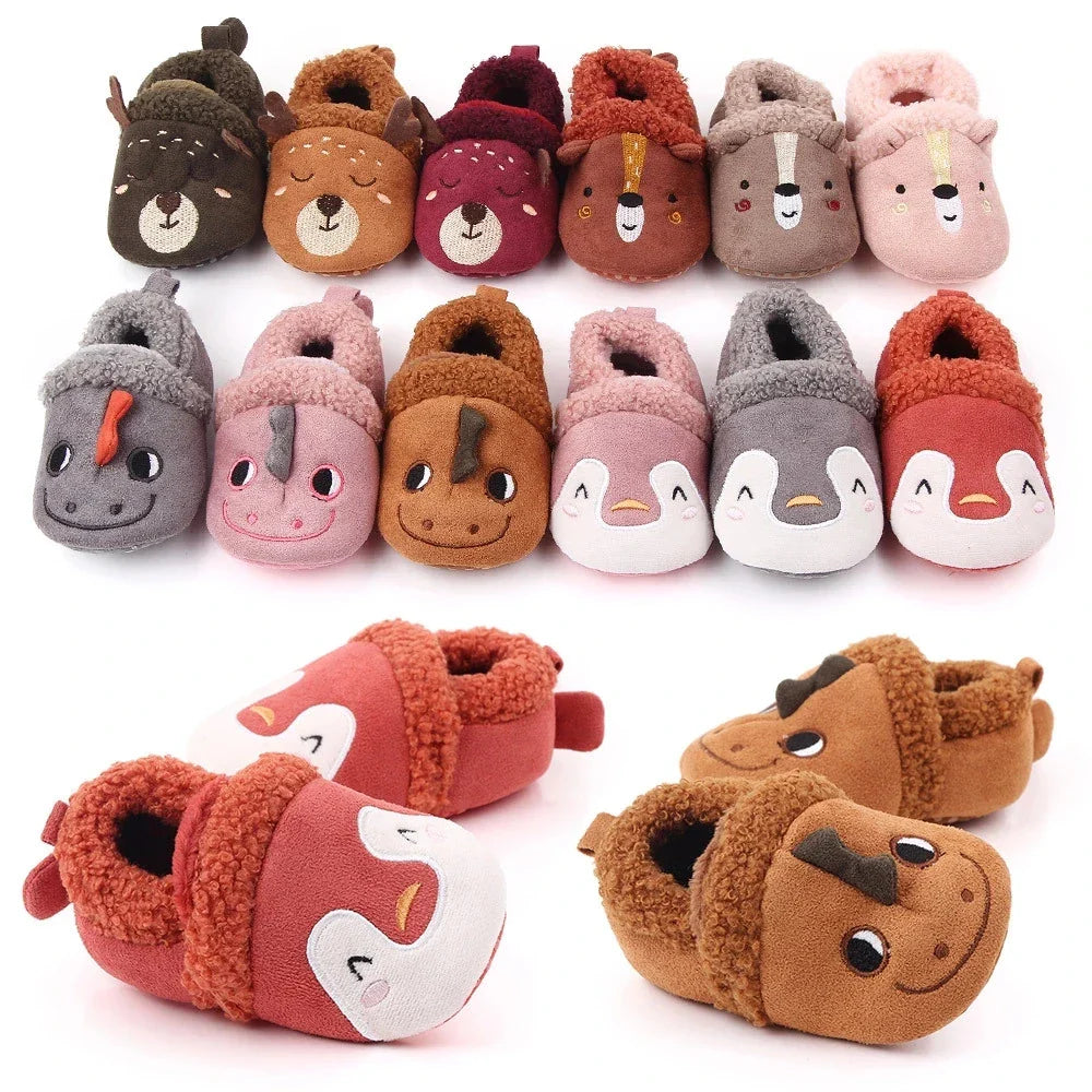 Baby slippers in penguin, bear, deer, and dragon designs with fuzzy trim.