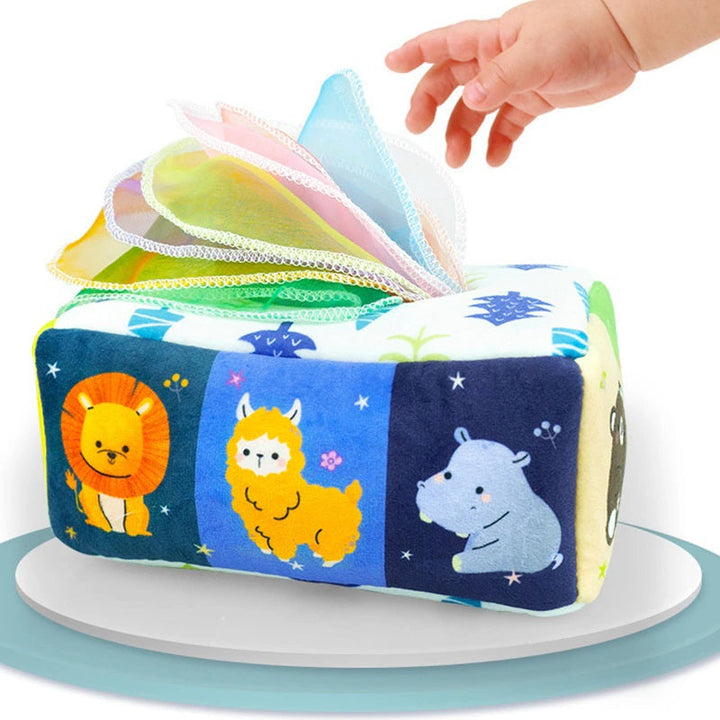 Animal-print fabric tissue box with colorful tissues and a hand reaching toward them