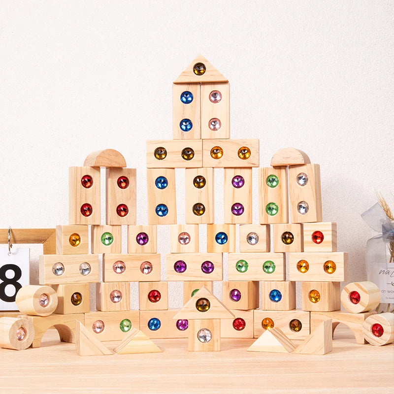 Wooden gem blocks arranged into a castle with a central tower and arched base