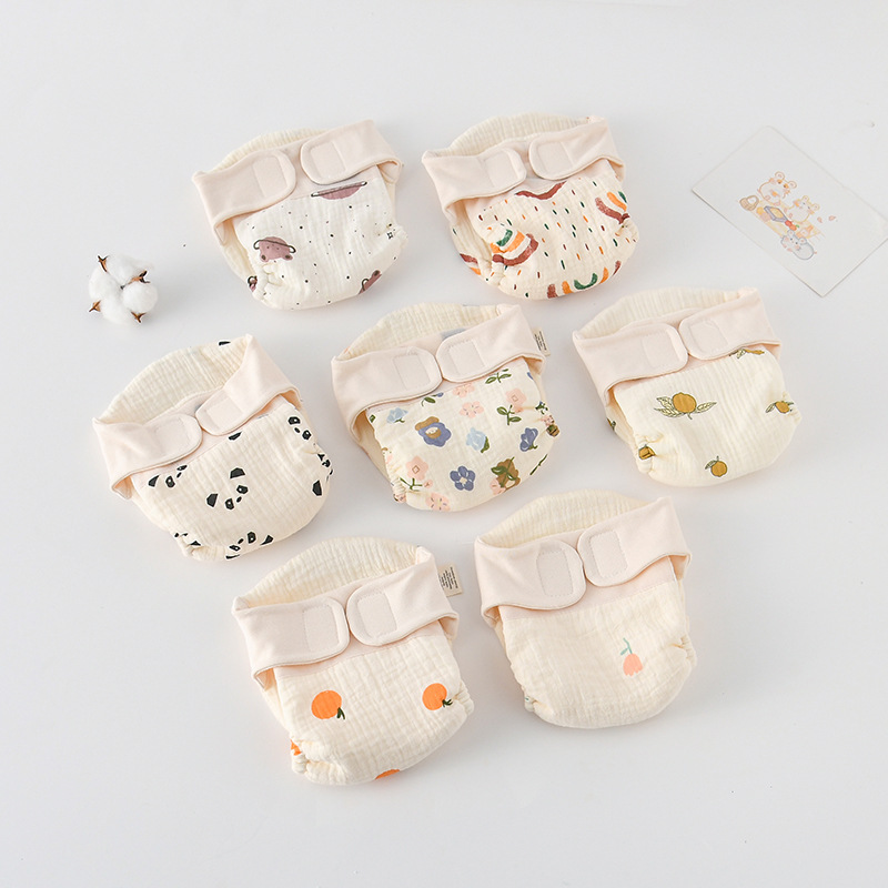 Assorted printed cloth diapers arranged with their hook-and-loop waistbands facing forward