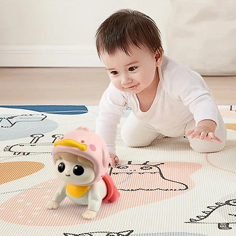 Baby reaching toward a pink musical crawling doll on a play mat