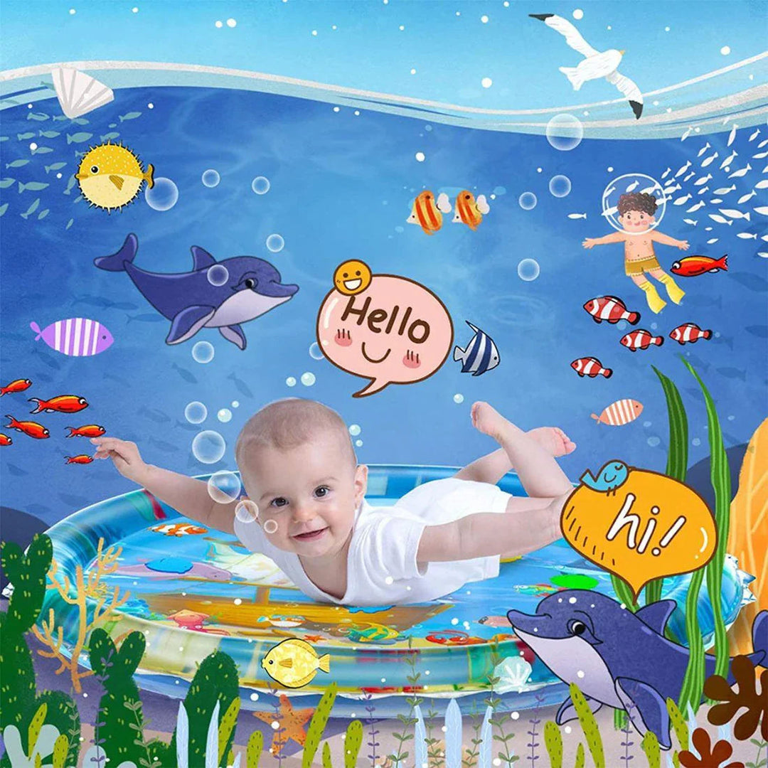 Baby practicing tummy time on a round water mat surrounded by colorful ocean illustrations