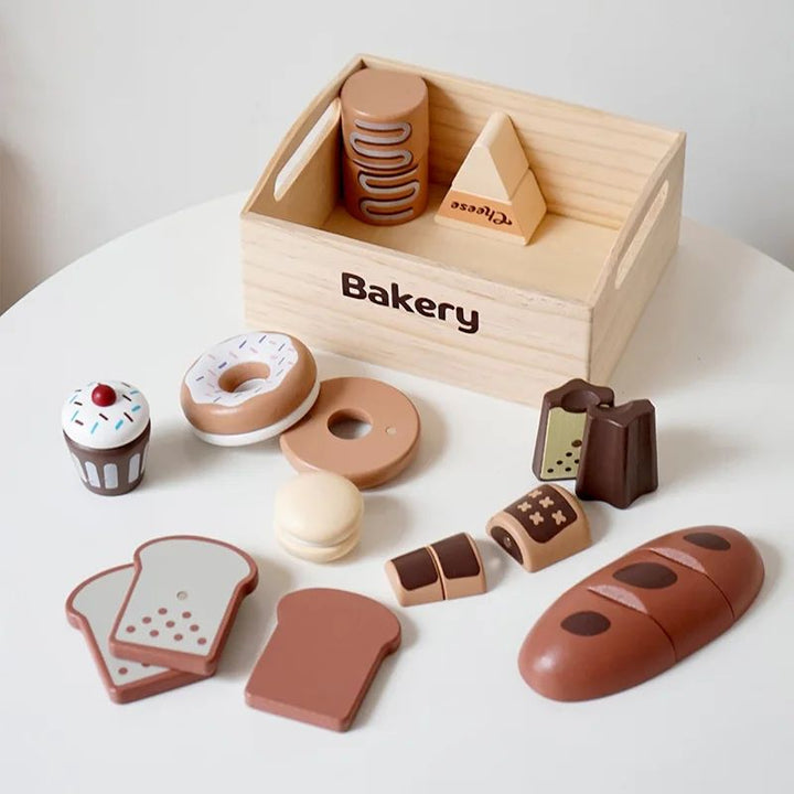 Bakery play food with a sliced loaf, toast, doughnuts, and a wooden crate