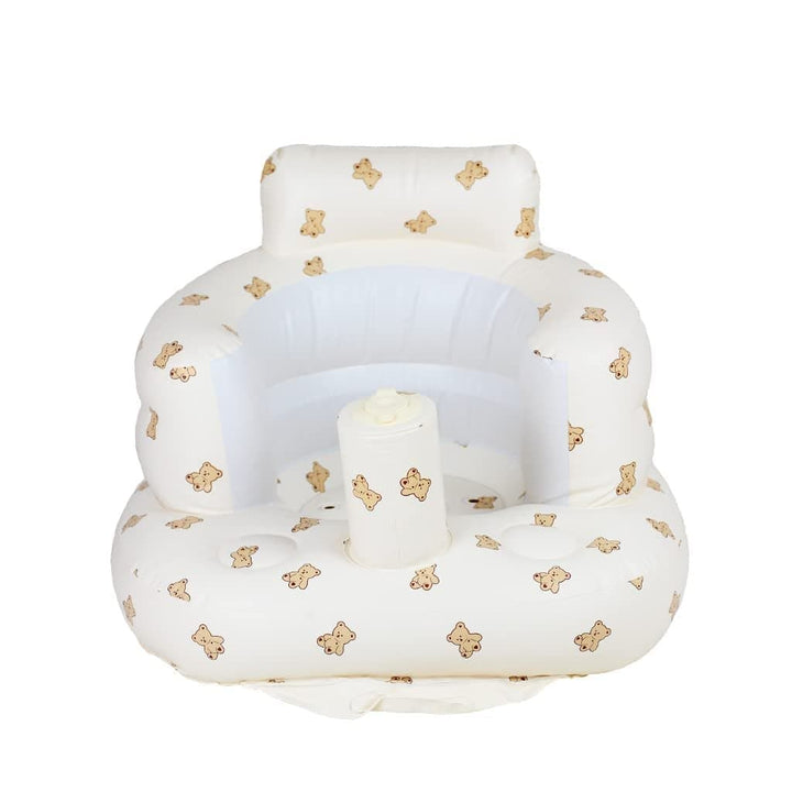 White bear-print inflatable baby seat with a wide backrest, rounded armrests, and a front support column.