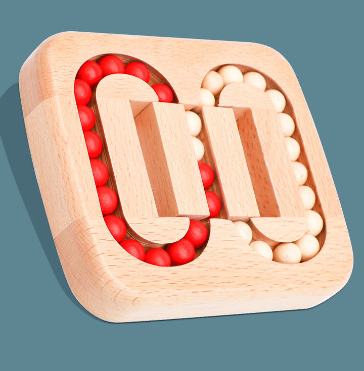 Angled view of the beech wood color-sorting puzzle with red and beige beads.