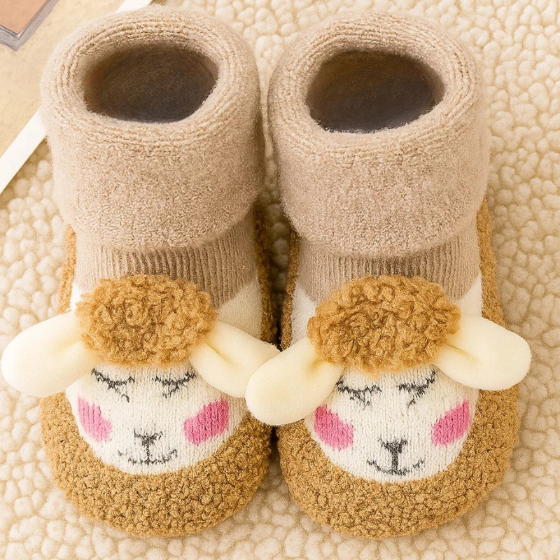 Beige baby socks with golden-brown toes, cream animal faces, and plush fold-over cuffs