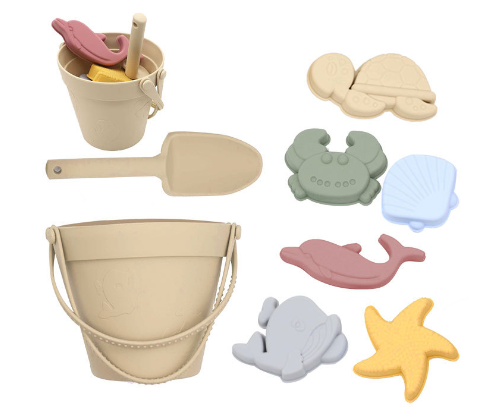 Beige silicone beach bucket and shovel with six colorful sea-themed sand molds.