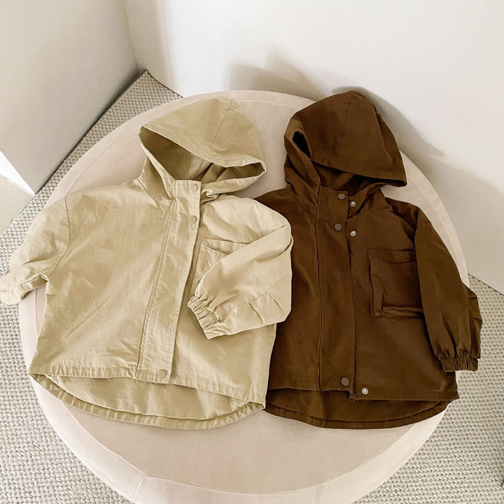 Beige and brown hooded parkas shown side by side with zip-and-snap fronts