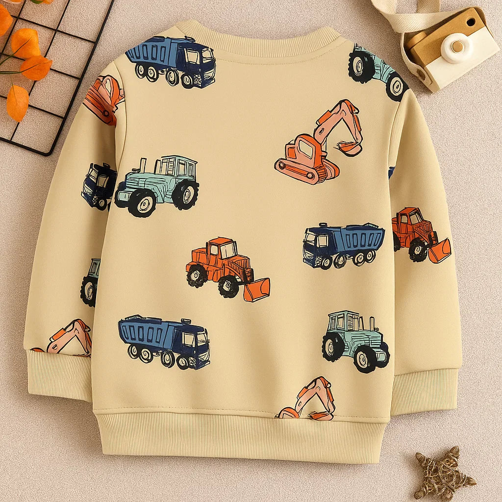 Beige children's sweatshirt with colorful construction vehicles, laid flat
