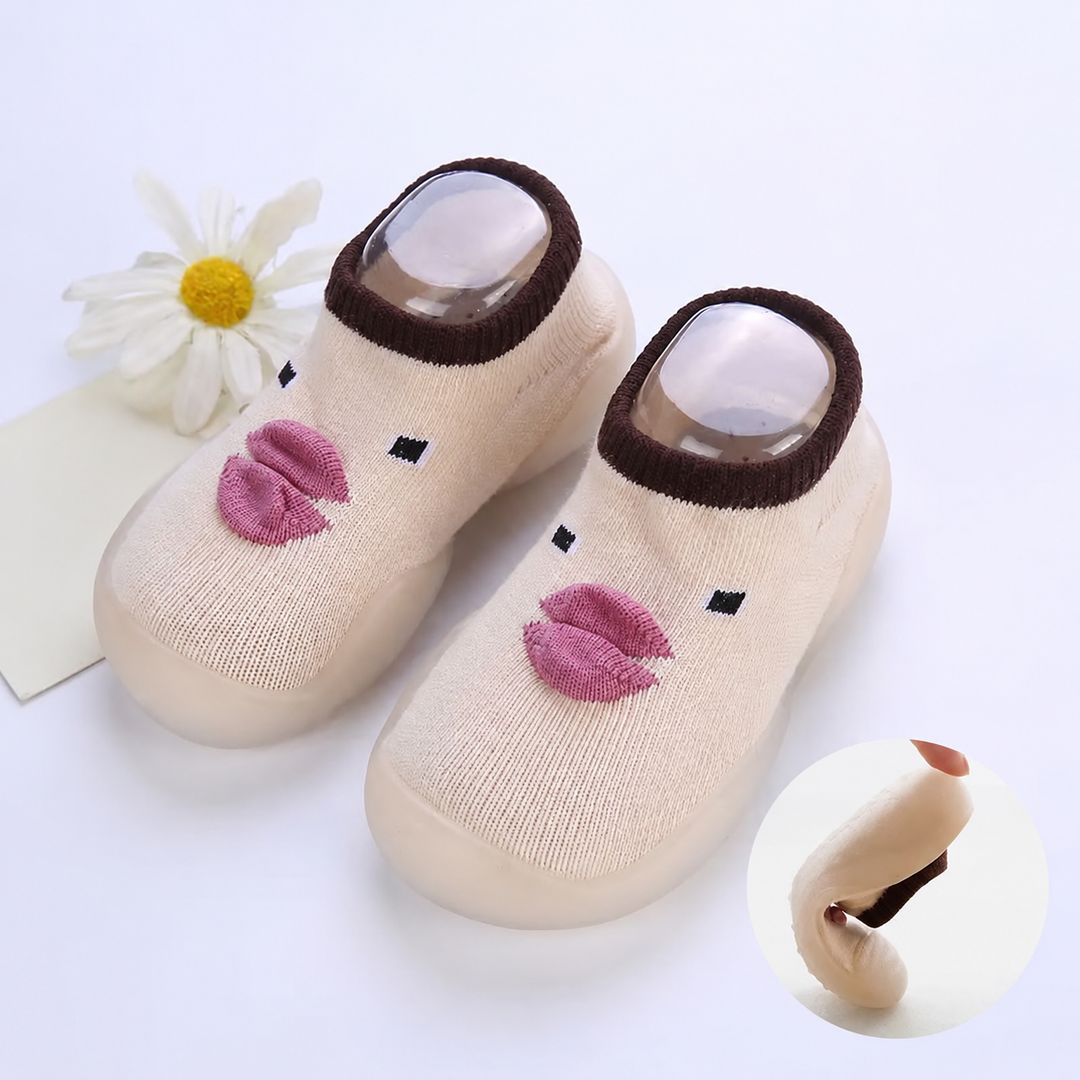 Beige duck-face sock shoes with an inset showing the sole bending
