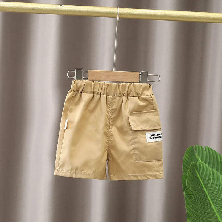Beige shorts with an elastic waistband and flap cargo pocket
