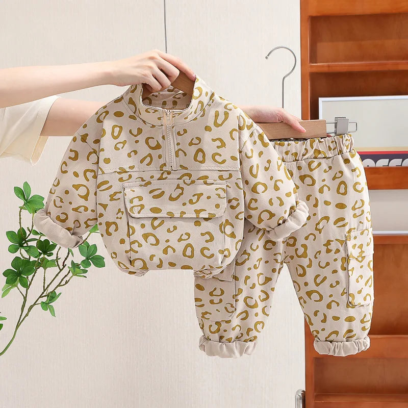 Beige leopard print pullover and matching pants with gathered cuffs.