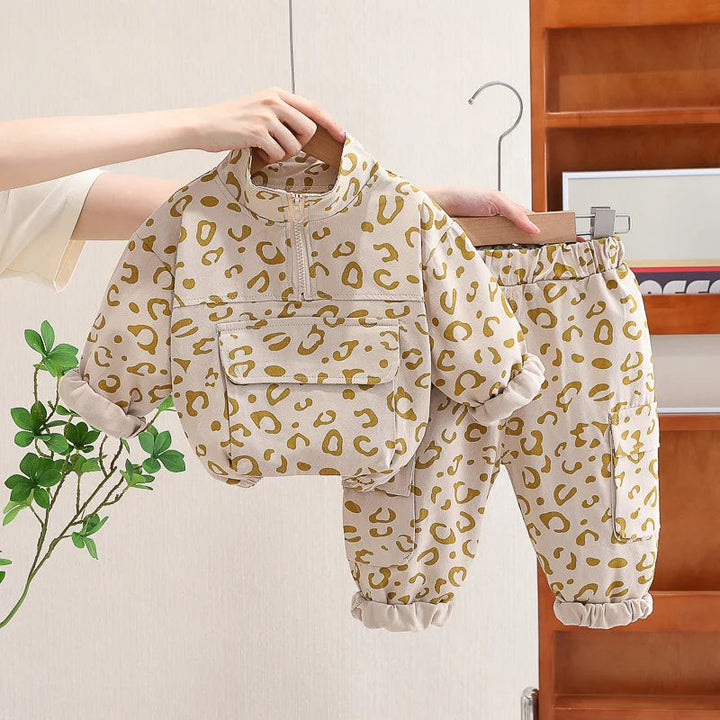 Beige leopard print pullover and matching pants with gathered cuffs.