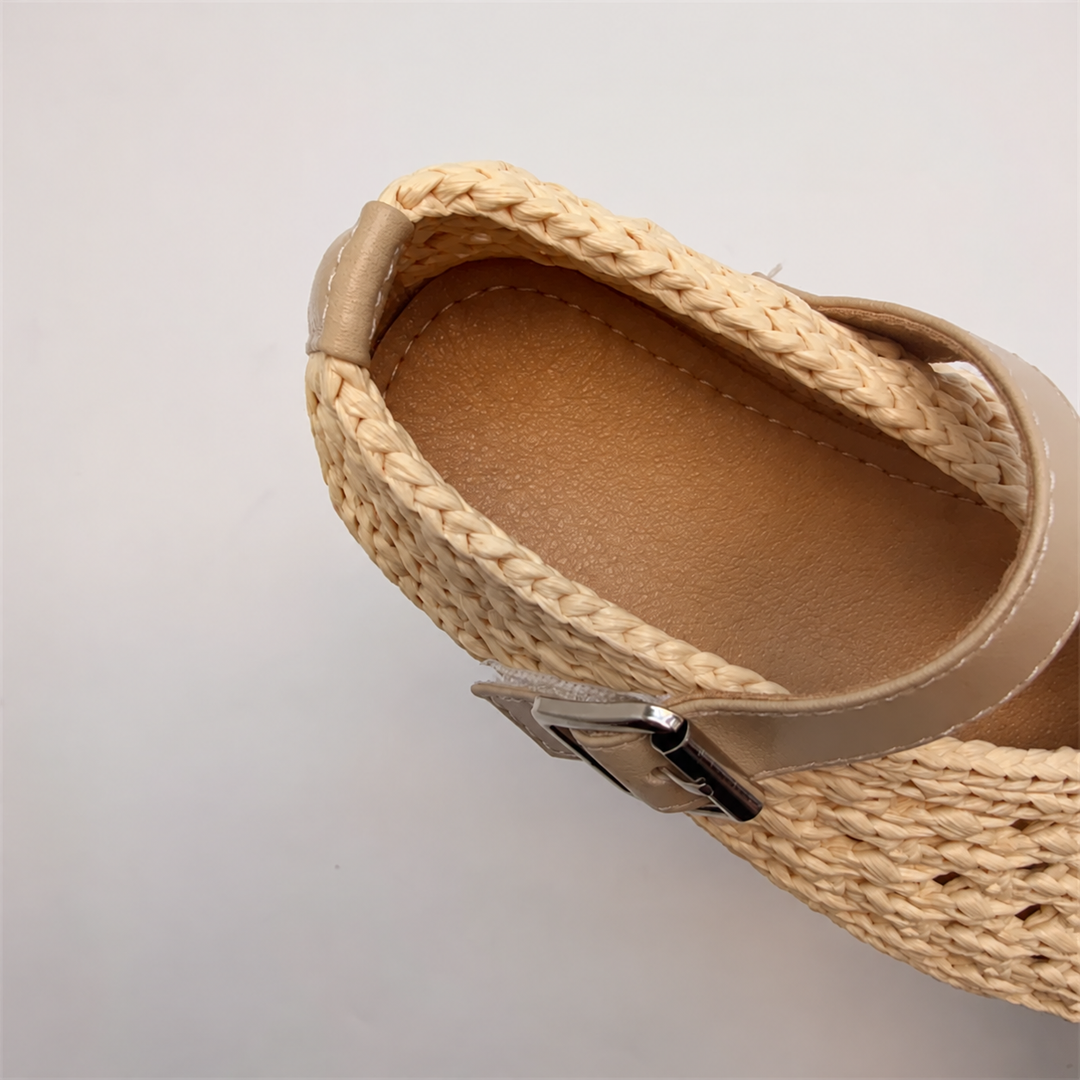 Close-up of the interior and heel opening of a beige Mary Jane flat