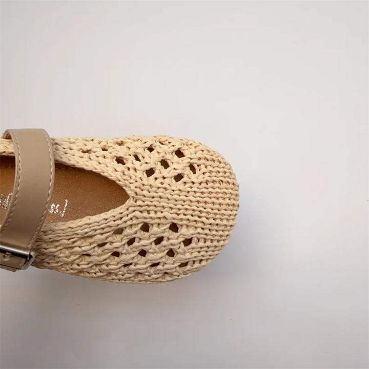 Close-up of a beige Mary Jane flat&
