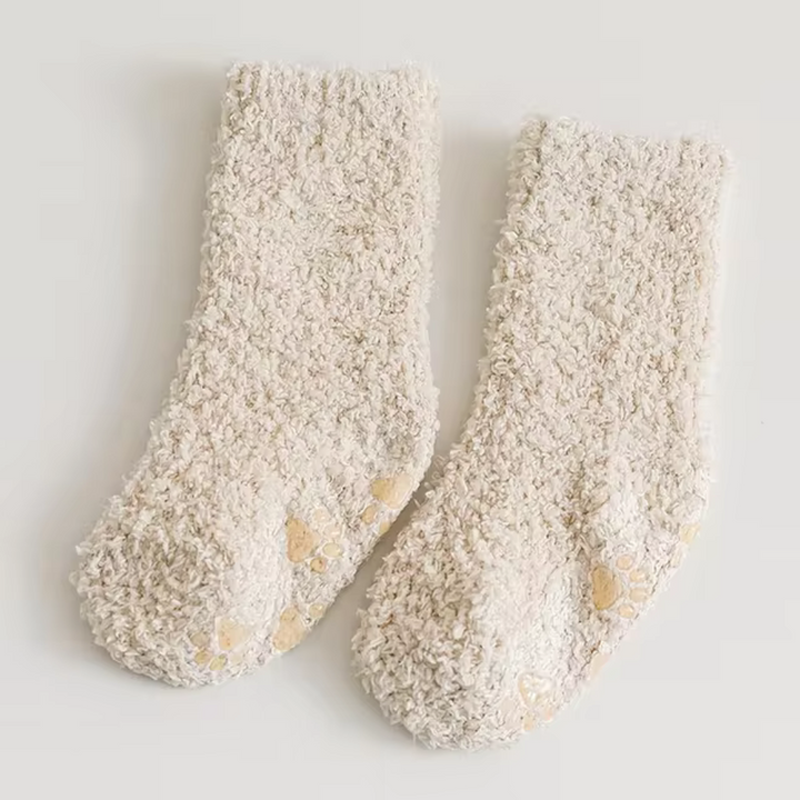 Beige fleece socks with paw-print details on the soles