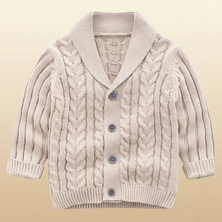 Beige cable-knit baby cardigan with a V-neck collar and gray buttons