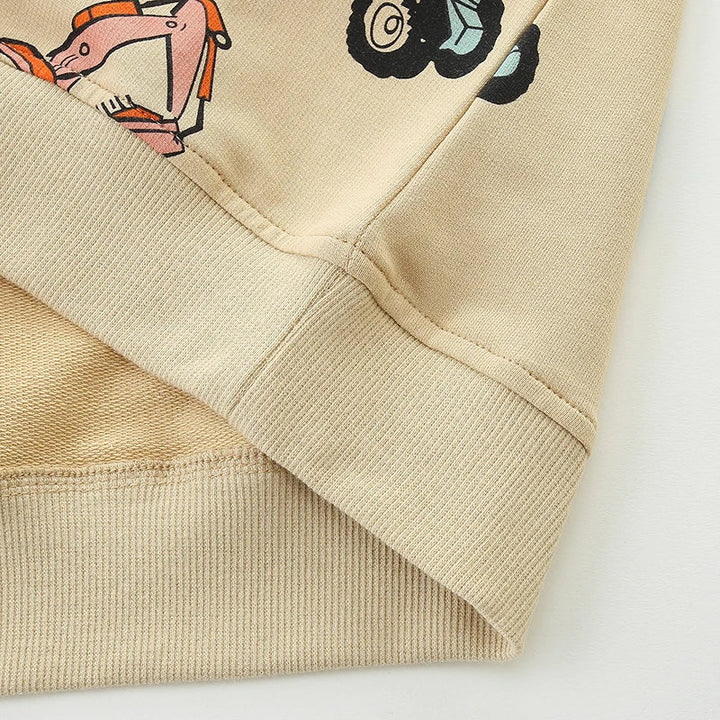 Close-up of the ribbed hem and sleeve cuff on the beige sweatshirt