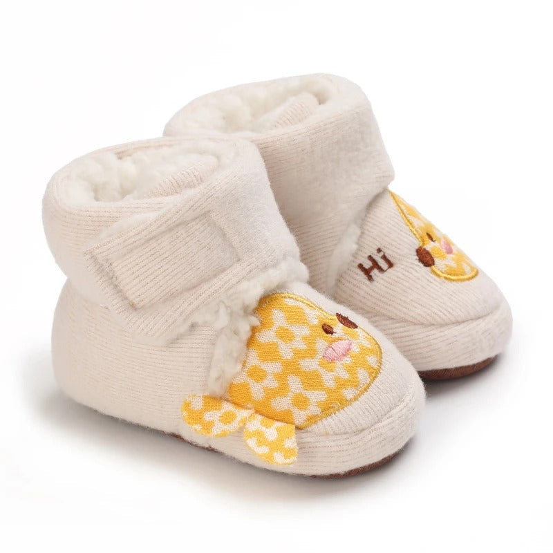 Beige baby shoes with yellow patterned fish accents and ankle straps.