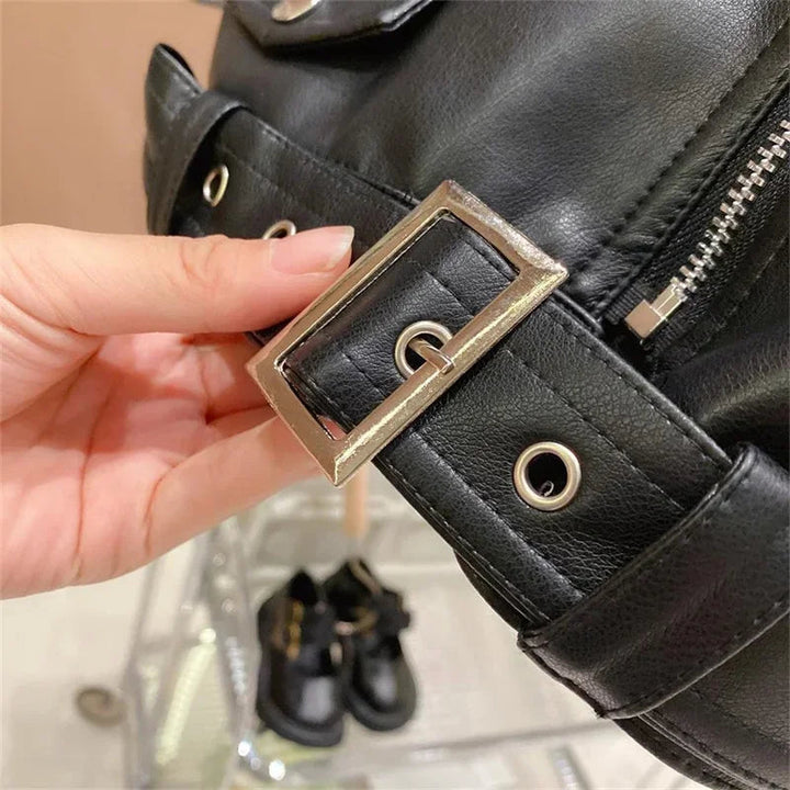 Close-up of the black biker jacket&