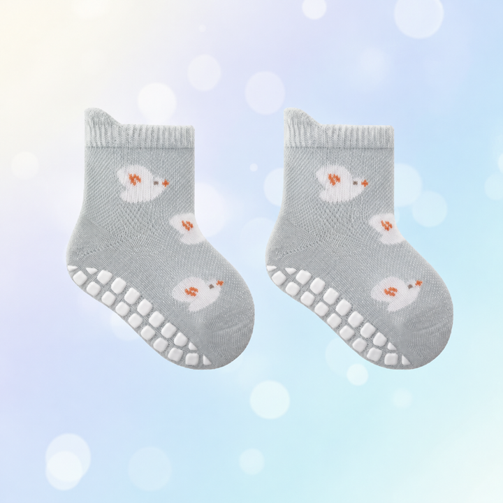 Blue-gray bird-pattern baby socks with ribbed cuffs and white sole grips.