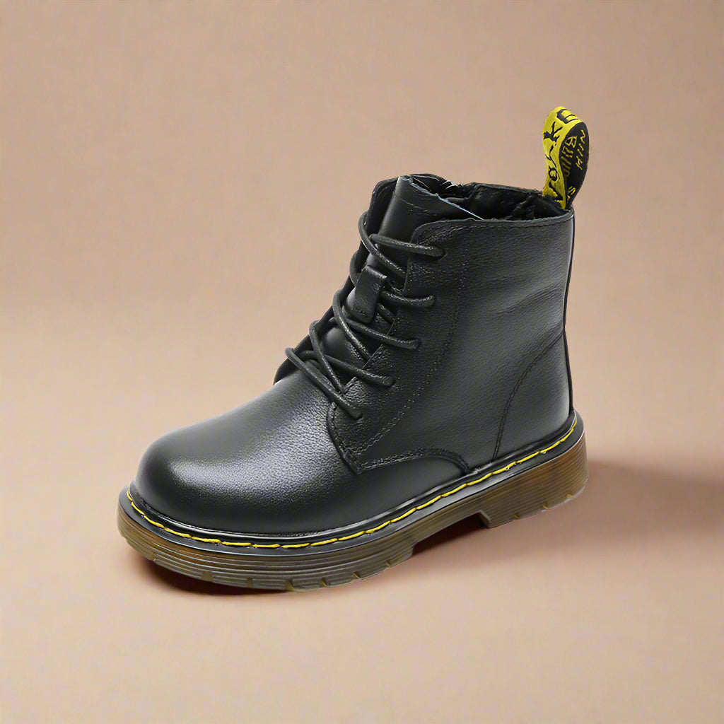 Black ankle lace-up boot with yellow stitching and a heel pull tab