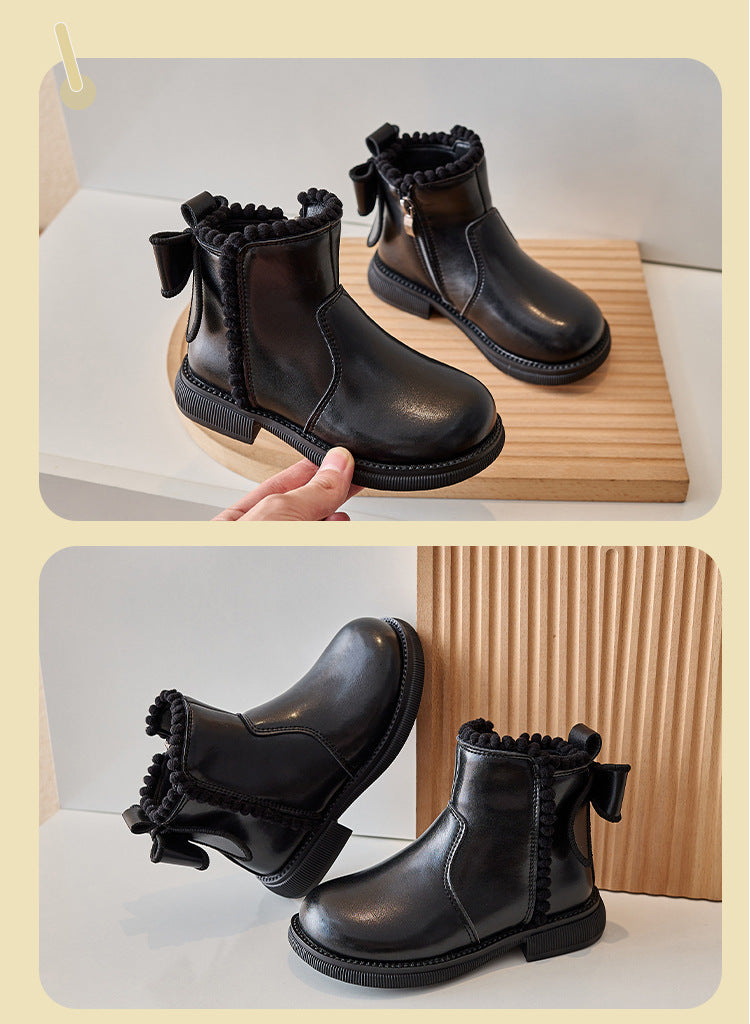 Two views of black ankle boots showing back bows, rounded toes, and decorative ankle trim