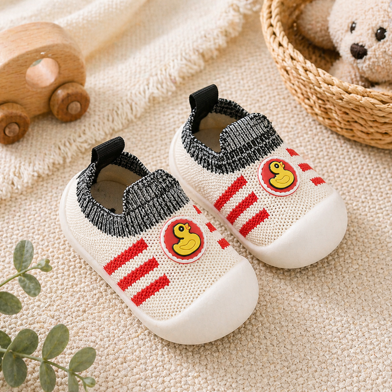 Red-striped duck sock shoes with black knit cuffs and white toe caps.