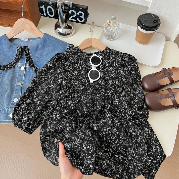 Black floral dress displayed beside the matching blue denim jacket