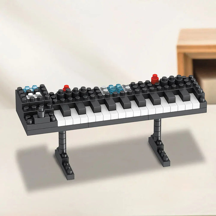 Black miniature keyboard block model with white keys and a two-legged stand