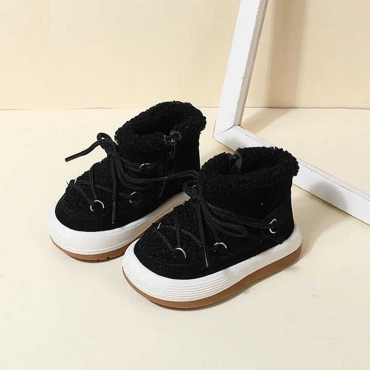 Black winter boots with faux fur collars and lace-up fronts