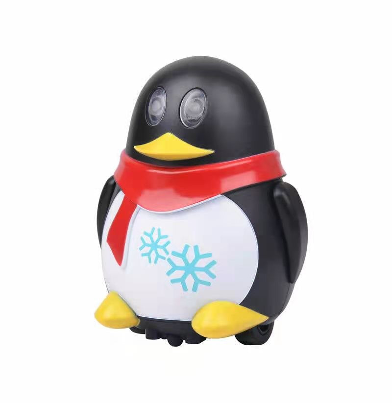 Black penguin toy with a red scarf, yellow feet, and blue snowflakes on its white belly.