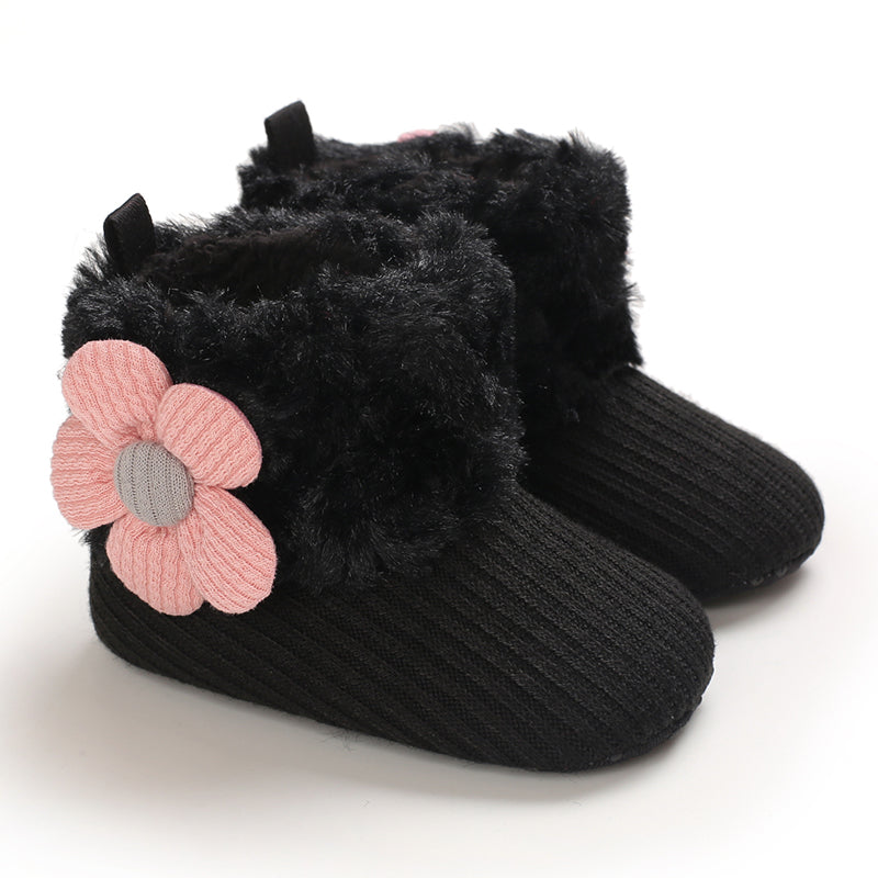 Black baby winter boots with pink flowers on the plush cuffs