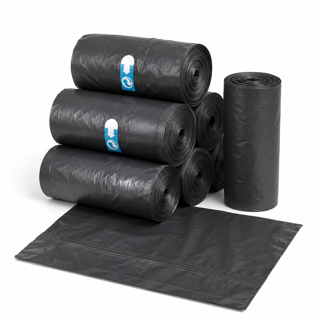 Rolls of black replacement potty liner bags with one bag laid out in front
