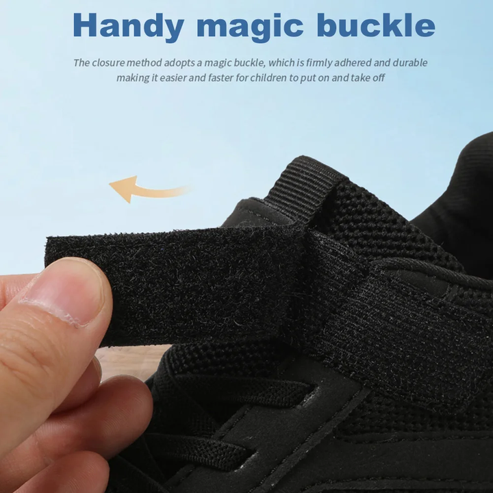 Hand opening the hook-and-loop strap on a black mesh sneaker