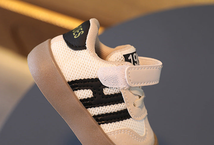 Side view of a black-striped kids&