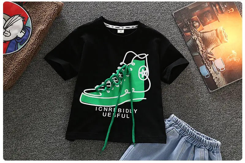Close-up of the green high-top sneaker graphic on the black short-sleeve T-shirt