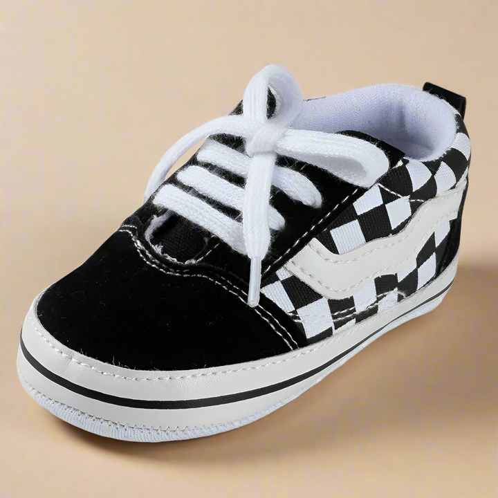Black-and-white checkered baby sneaker with white laces