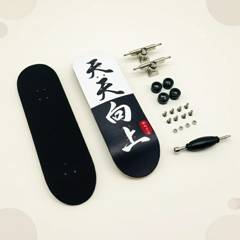 Black-and-white graphic fingerboard deck with grip pad, black wheels, trucks, hardware, and a tool.
