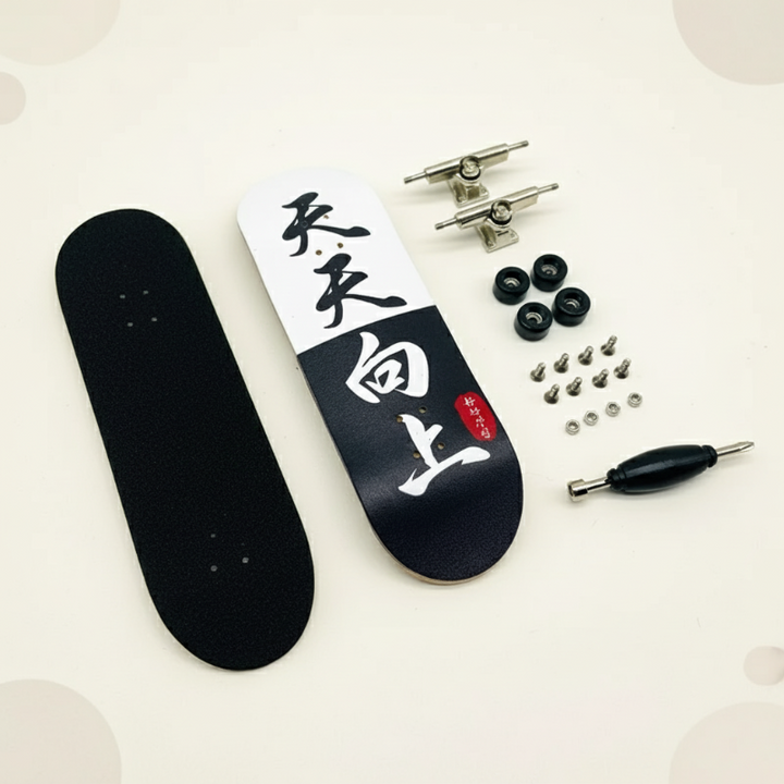 Black-and-white graphic fingerboard deck with grip pad, black wheels, trucks, hardware, and a tool.