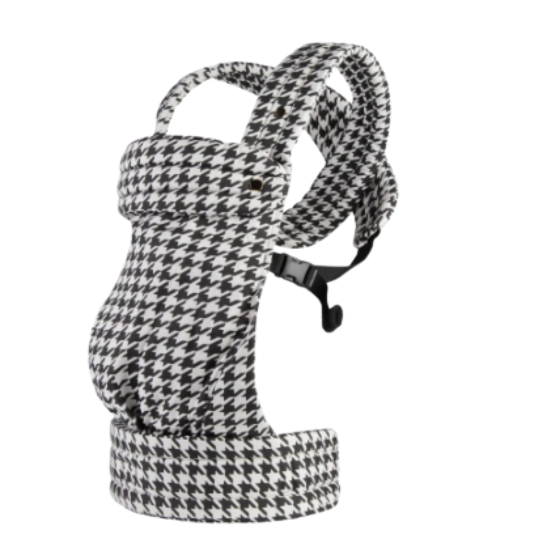 Black-and-white houndstooth baby carrier with padded shoulder straps and waist support