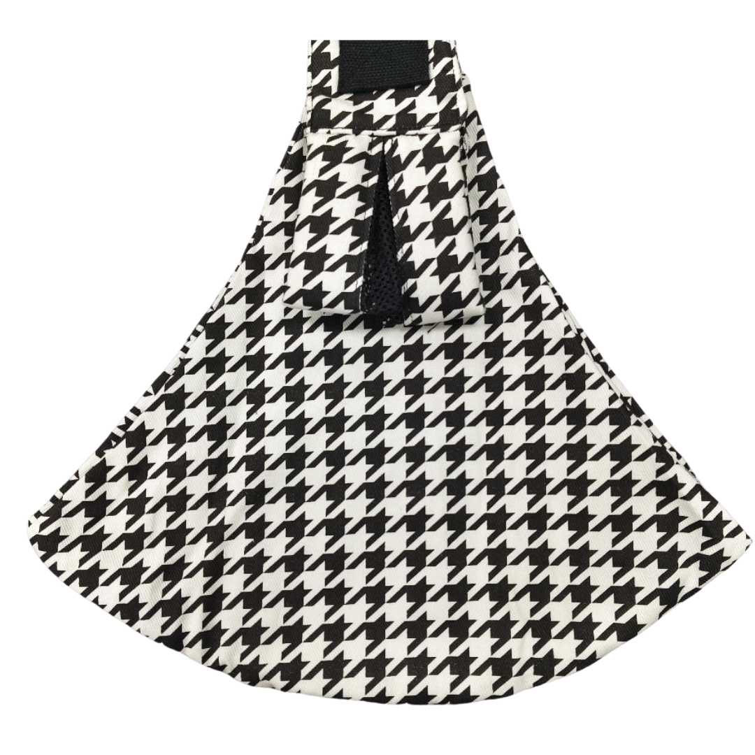 Black-and-white houndstooth hip carrier with a wide fabric seat