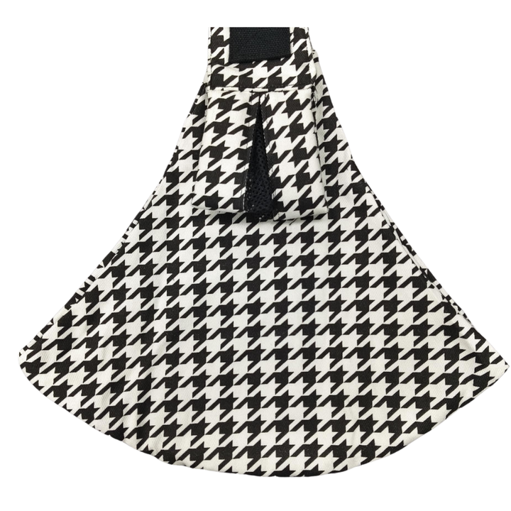 Black-and-white houndstooth hip carrier with a wide fabric seat