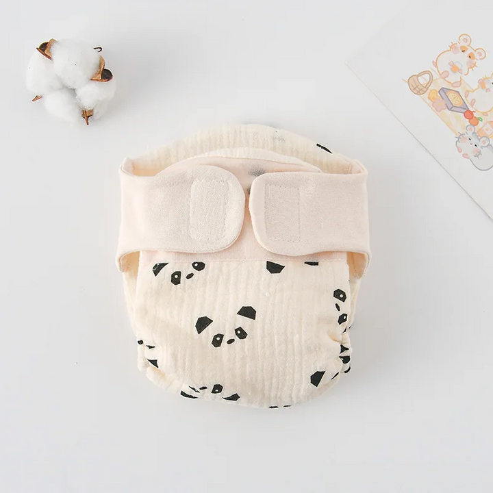 Panda-face print cloth diaper with a cream hook-and-loop waistband