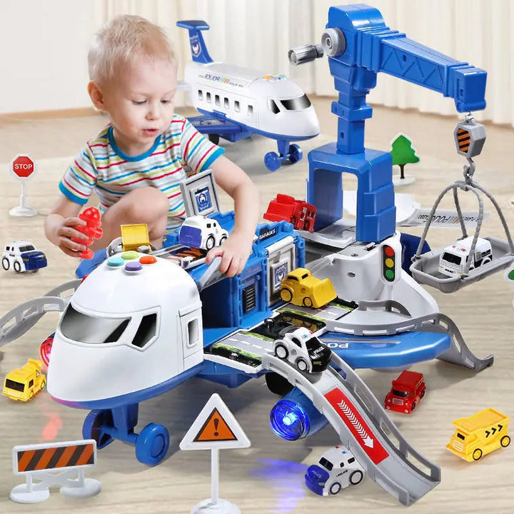 Child playing with a blue airplane playset, movable crane, cars, ramps, and traffic signs.